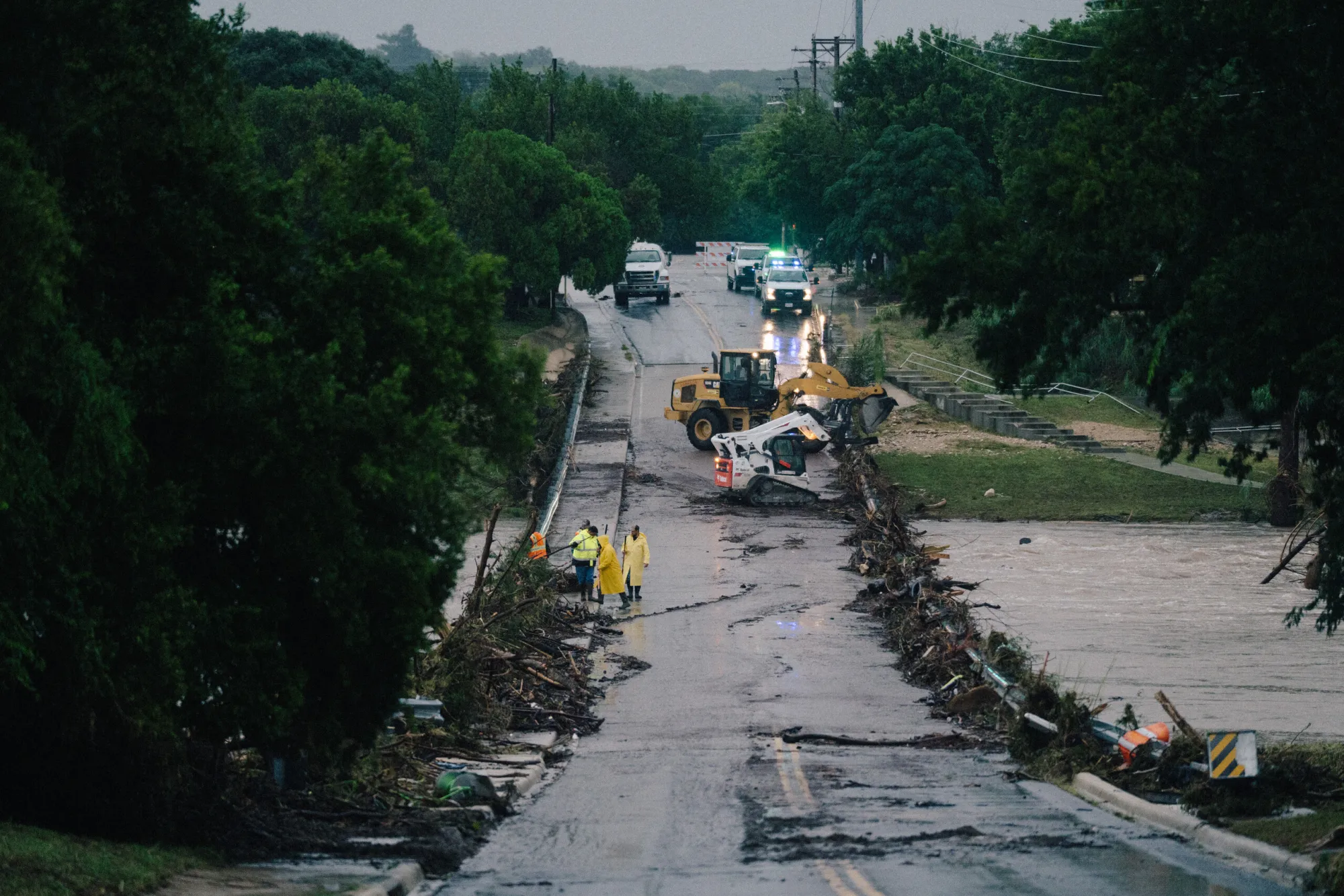 First responders on a bridge covered by water after the flood in Kerrville on July 16, 2026.