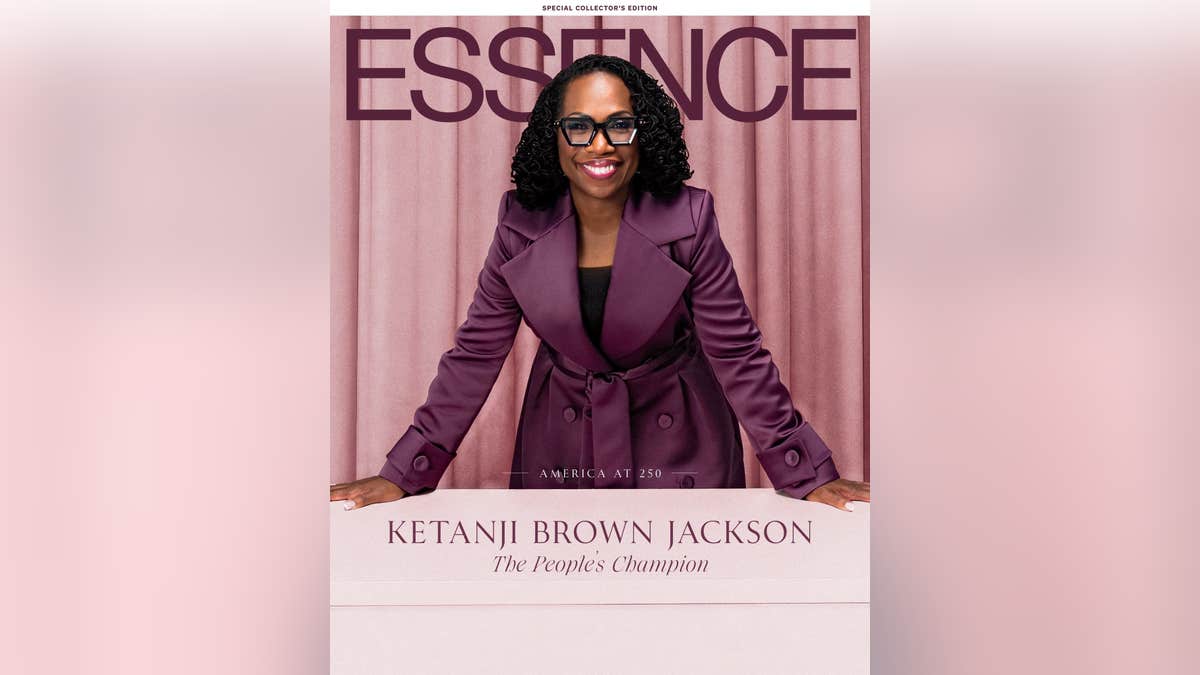 Justice Ketanji Brown Jackson appears on the cover of Essence Magazine, smiling in a purple coat. The text 