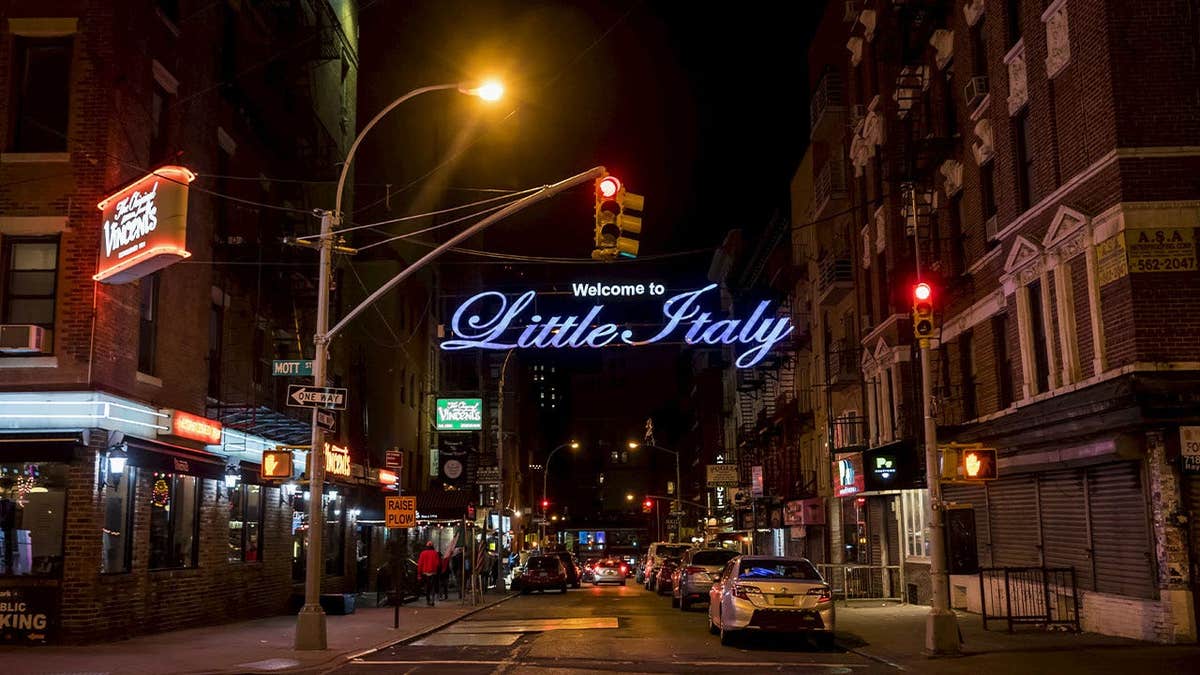Little Italy street sign and neighborhood in Manhattan, New York City