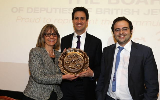Labor leader David Miliband, flanked by Board of Deputies Vice President Laura Marks and Jewish News editor Richard Ferrer, shows off a seder plate he received at Thursday's Q&A. (Courtesy of Marc Morris)