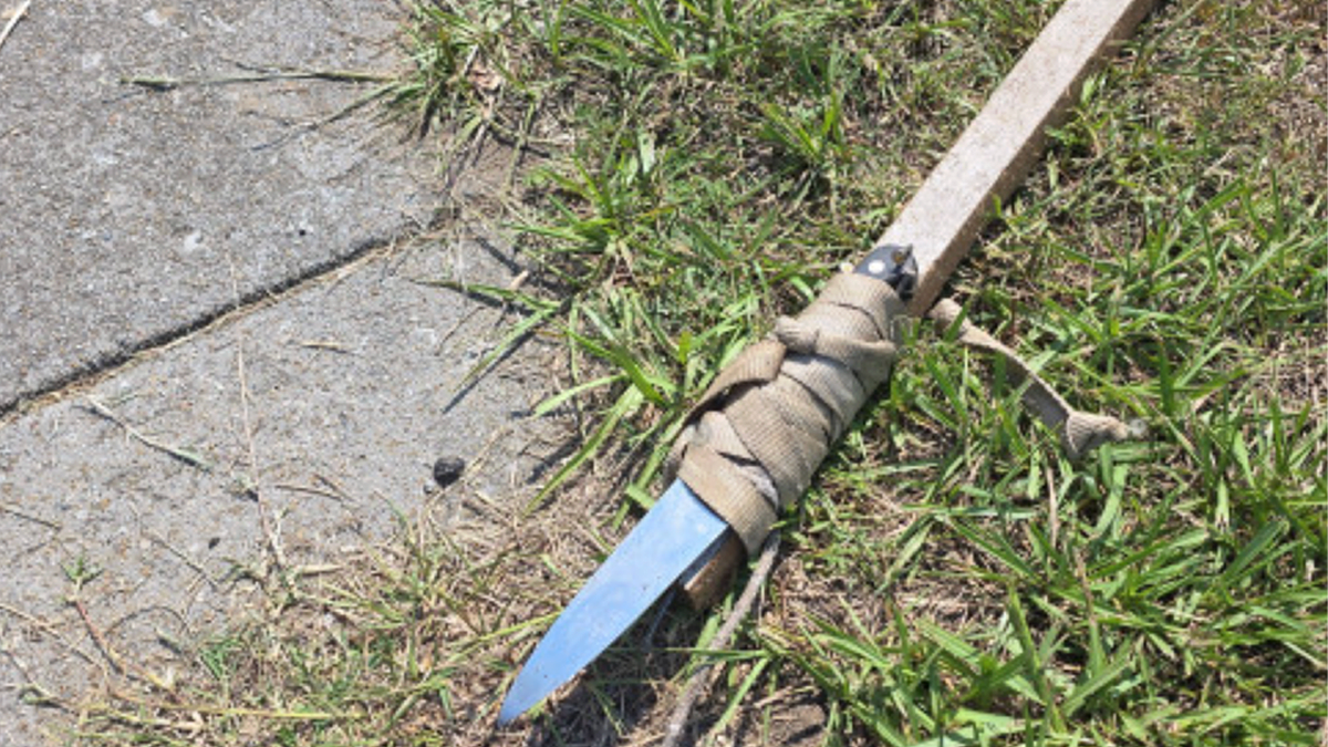 A makeshift spear with a knife blade attached to a wooden handle recovered by North Charleston police after a chaotic July 4 block party in South Carolina