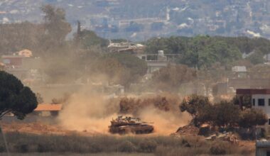 An Israeli tank drove through Zawtar al-Sharqiyah village, occupied by Israeli forces, as seen from the southern village of Zawtar al-Gharbieh, Lebanon, on Monday.