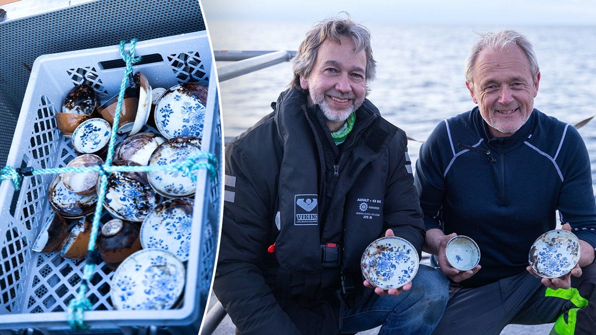 View of cargo haul, two men holding porcelain artifacts
