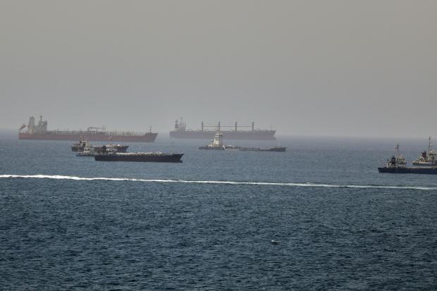 Tankers and cargo vessels are seen in the Gulf of Oman.
