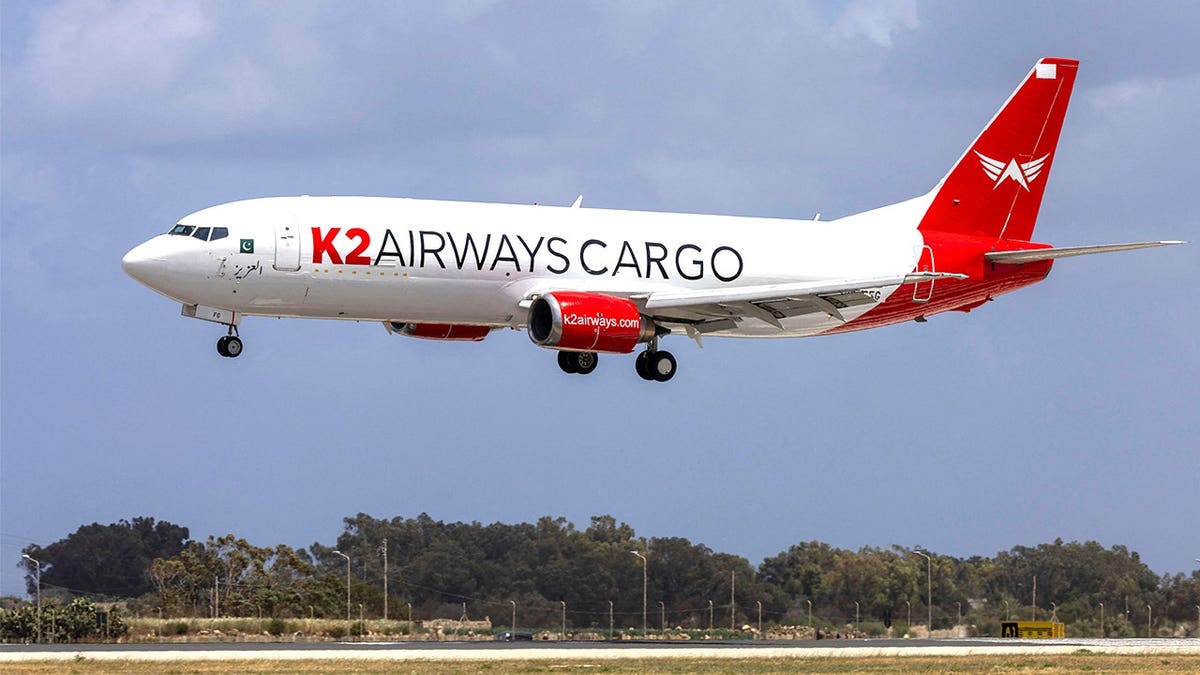 K2 Airways cargo plane landing at airport