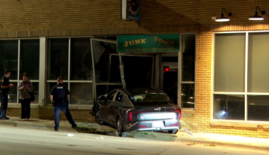 Car crashes into Omaha business, sends one to hospital