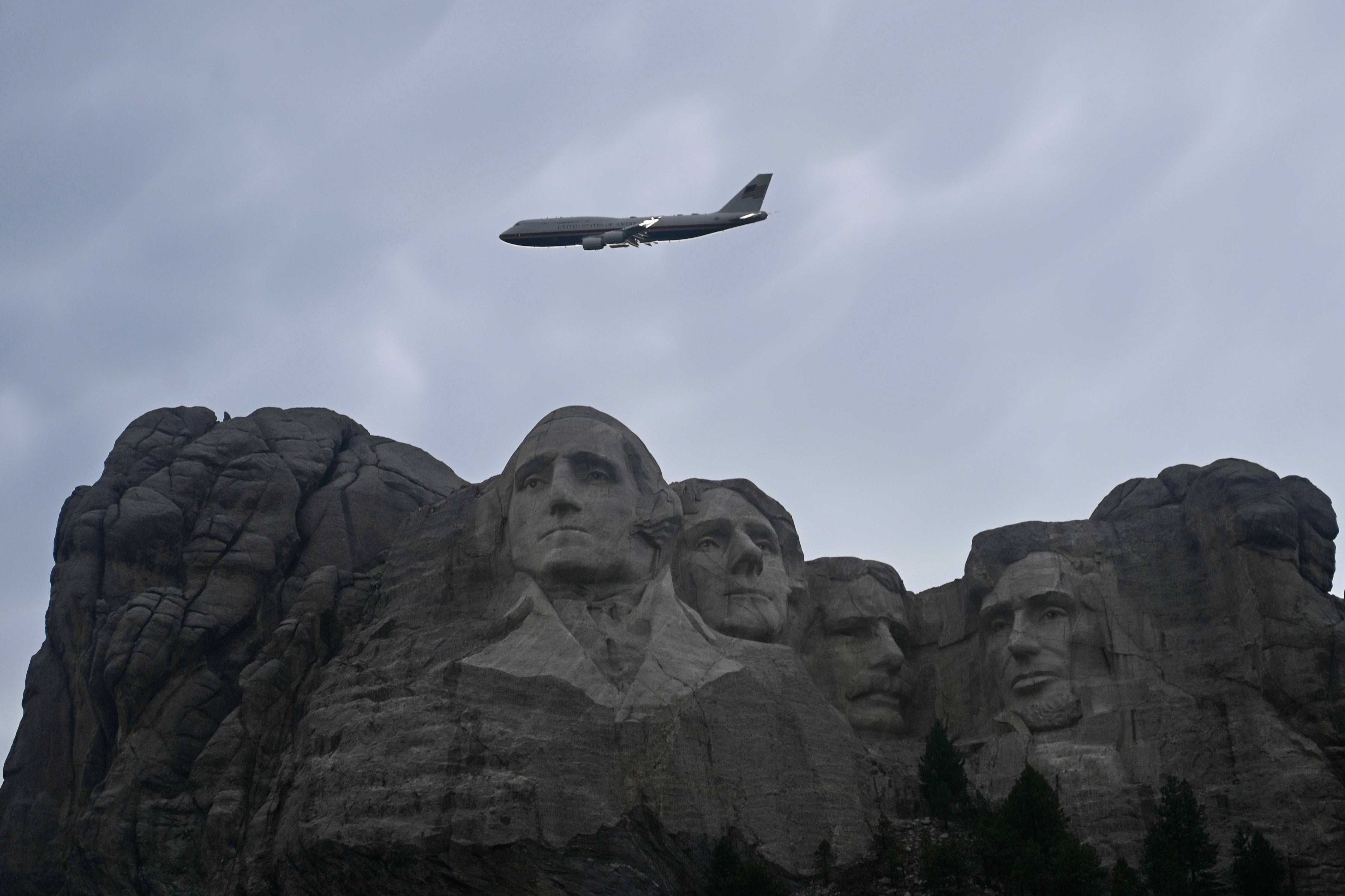 Air Force One flies over Mount Rushmore on Friday ahead of President Donald Trump’s speech