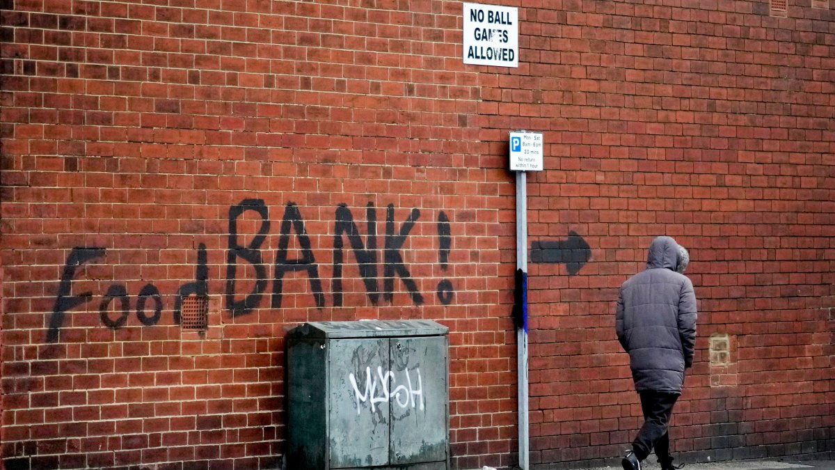 LEEDS, ENGLAND - OCTOBER 21: A sign painted on the side of a house directs people to a local food bank on October 21, 2022 in Leeds, England. A report from the Office for National Statistics (ONS) published earlier this week showed consumer prices index rising to 10.1% in September, with food and drink rising at a rate of 15%, the largest jump in decades and forcing many people to use charity food banks. (Photo by Christopher Furlong/Getty Images)
