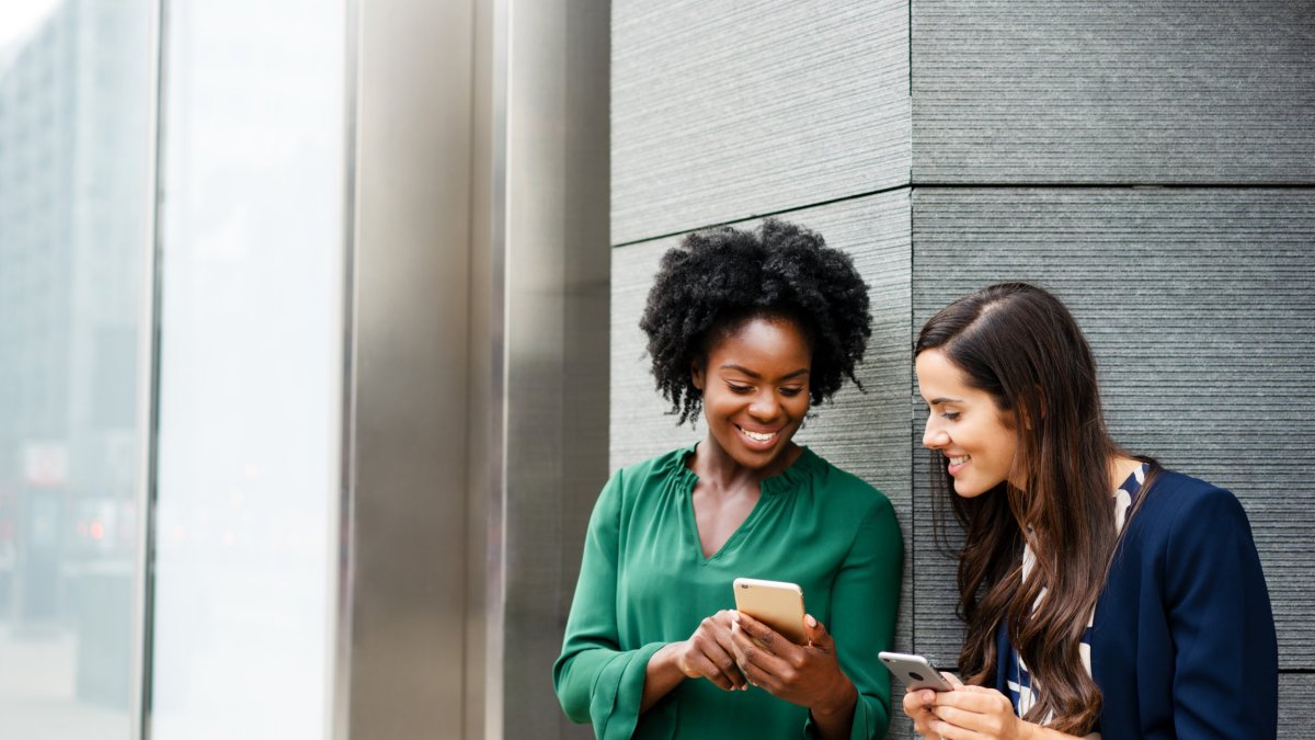 Women, African-american Ethnicity, caucasian ethnicity , , multi-ethnic group, 20-29 Years, Adults Only, Young Women, Corporate Business, Colleague, Businesswoman, , , , Friendship, Young Adult, Only Women, Business, Two People, , Showing, Wall - building feature, Formalwear, Standing, Waist Up, , , , Day, Outdoors, Horizontal, London - England, England, Uk, Smart Phone, Social Media, Communication, Wireless Technology, Using Phone, Mobile Phone, , Taking A Break, , Text Messaging, Convenience, Portability,