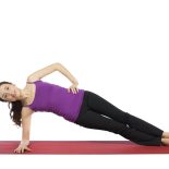 Woman is doing a variation of plank pose.