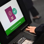A person as their passport scanned whilst using an Automated European Union Entry/Exit System (EES) kiosk during a press preview on the rollout of the EU's new Entry-Exit System (EES) at Eurotunnel, south east England on September 23, 2025. The European Union's new border-check system for non-EU nationals, the so-called Entry/Exit System (EES), which will do away with passport stamps, is set to finally launch October 12. (Photo by Justin TALLIS / AFP) (Photo by JUSTIN TALLIS/AFP via Getty Images)