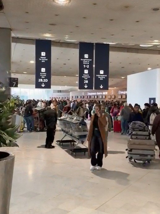 A family missed their flight home from a trip to Disneyland Paris after being stuck for more than five hours in queues for new EU border biometric checks. David Newton, his wife Kimberley and their four-year-old daughter Frankie Mae were forced to go through Entry-Exit System (EES) checks twice in a day after missing their flight due to delays at Charles de Gaulle airport. Mr Newton, 43, from Stourbridge, West Midlands and his family arrived three hours before their return flight to Birmingham with easyJet on 16 March, but ended up stranded for 11 hours at the Paris airport. Footage supplied by David Newton