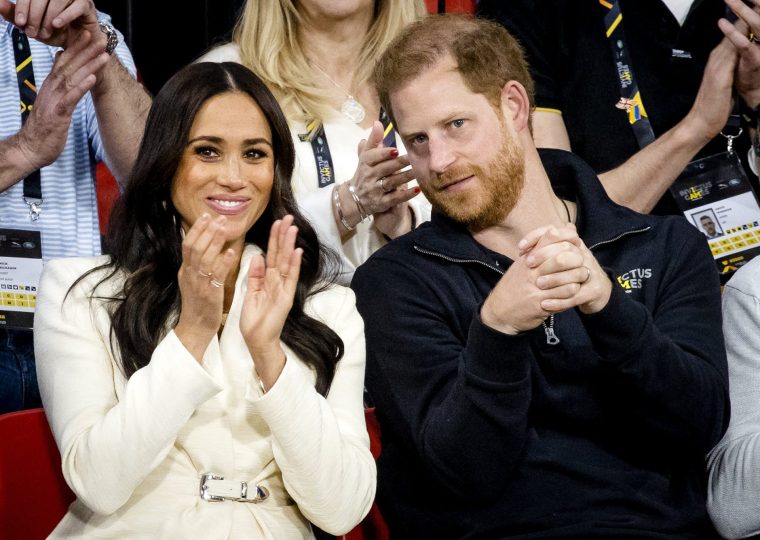 (FILES) The Duke and Duchess of Sussex, Prince Harry and his wife Meghan Markle visit the sitting volleyball section of the fifth edition of the Invictus Games in The Hague on April 17, 2022. Prince Harry, Duke of Sussex, Meghan, Duchess of Sussex and their children are to make their first family visit to Britain in four years, it was reported on June 17, 2026. (Photo by Sem van der Wal / ANP / AFP via Getty Images) / Netherlands OUT