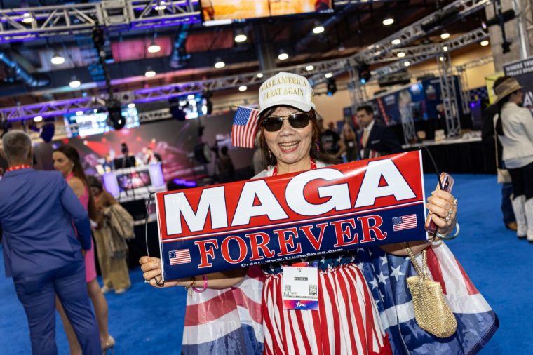 A woman wearing Trump paraphernalia poses during the Conservative Political Action Conference (CPAC) at the Gaylord Texan Resort and Convention Center in Grapevine, Texas, on March 27, 2026. American conservatives converge on Texas this week for what organizers bill as their largest and most influential gathering, with the Iran war and fears of a punishing midterm election cycle heightening the stakes. (Photo by Leandro Lozada / AFP via Getty Images)