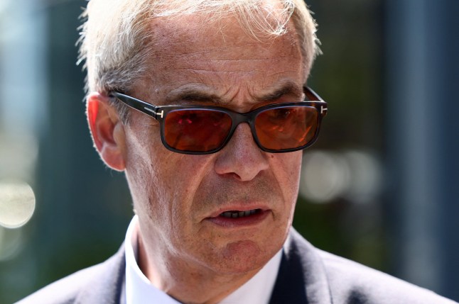 Leader of the Reform UK party Nigel Farage walks in Frinton-on-Sea, after he announced on Tuesday that he has resigned as an MP, triggering a by-election in his parliamentary seat, where he intends to stand for re-election, in Frinton-On-Sea, Britain, July 8, 2026. REUTERS/Jack Taylor