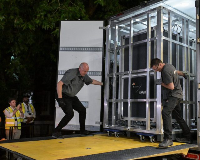 Workers unload a specially designed crate carrying the Bayeux Tapestry at the British Museum in central London early on July 10, 2026, as the 11th-century artwork depicting the 1066 Norman conquest of England arrives ahead its first UK exhibition from September. The medieval Bayeux Tapestry arrived in London in the early hours of July 10, after a hugely complicated journey to leave France for the first time in more than 900 years for an exhibition in the British capital. (Photo by Richard A. Brooks / AFP via Getty Images)