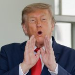 U.S. President Donald Trump calls out to the reporters as he greets Iraqi Prime Minister Ali al-Zaidi outside the West Wing at the White House in Washington, D.C., U.S., July 14, 2026. REUTERS/Evan Vucci