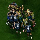 Argentina's midfielder #24 Enzo Fernandez (hidden) celebrates scoring his team's first goal with teammates during the 2026 World Cup football tournament semi-final match between England and Argentina at the Atlanta Stadium in Atlanta on July 15, 2026. (Photo by Jewel SAMAD / AFP via Getty Images)