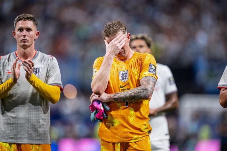 ATLANTA, GEORGIA - JULY 15: Jordan Pickford of England looks dejected after the FIFA World Cup 2026 Semi Final match between England and Argentina at Atlanta Stadium on July 15, 2026 in Atlanta, Georgia. (Photo by Marvin Ibo Guengoer - GES Sportfoto/Getty Images)