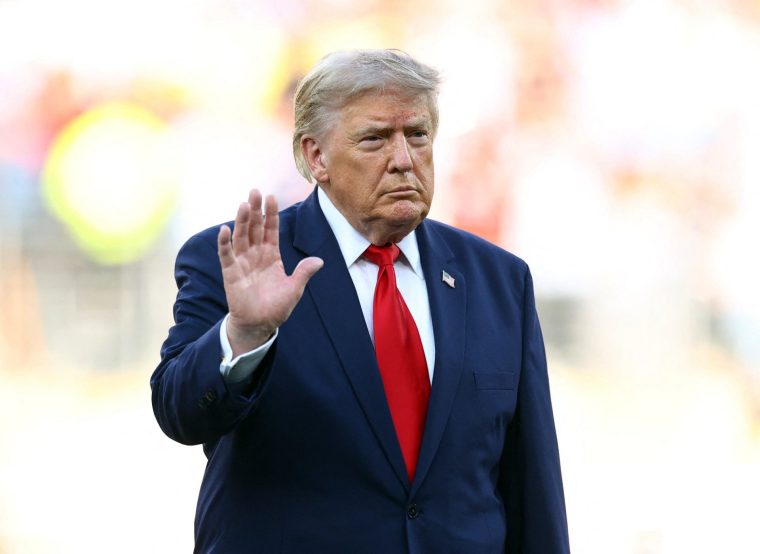Donald Trump waves to the crowd ahead of the trophy presentation (Photo: Reuters)