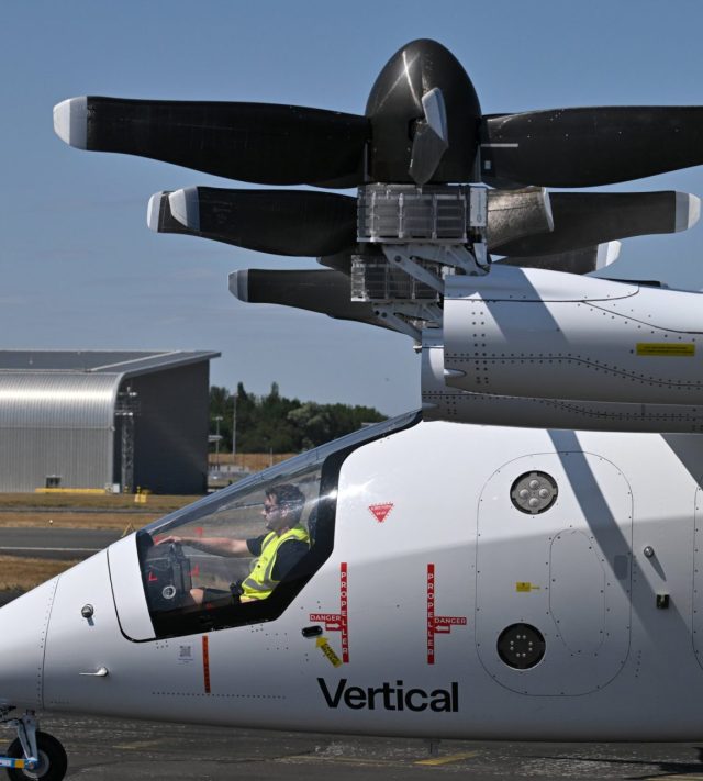 FARNBOROUGH, ENGLAND - JULY 20: The Vertical Aerospace VA-1X fully electric vertical take-off and landing (eVTOL) is manoeuvred during the Farnborough International Air Show 2026 at Farnborough International Exhibition Centre on July 20, 2026 in Farnborough, England. Farnborough International Airshow 2026 hosts leading innovators from the aerospace, aviation and defence industries. (Photo by John Keeble/Getty Images)