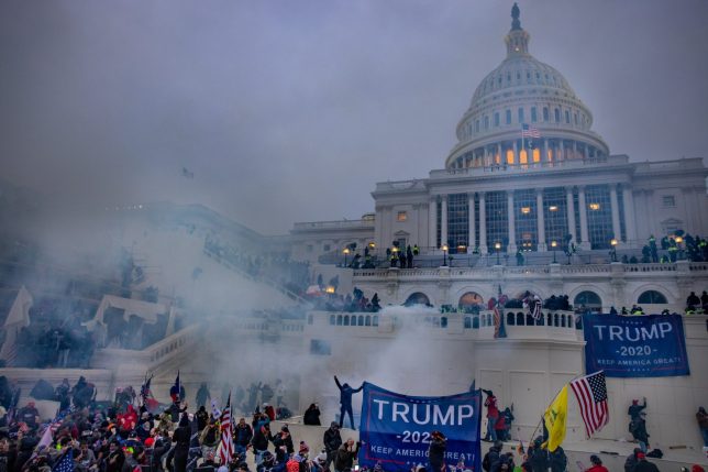 WASHINGTON,DC-JAN6: Tear gas is fired at supporters of President Trump who stormed the United States Capitol building. (Photo by Evelyn Hockstein/For The Washington Post via Getty Images)