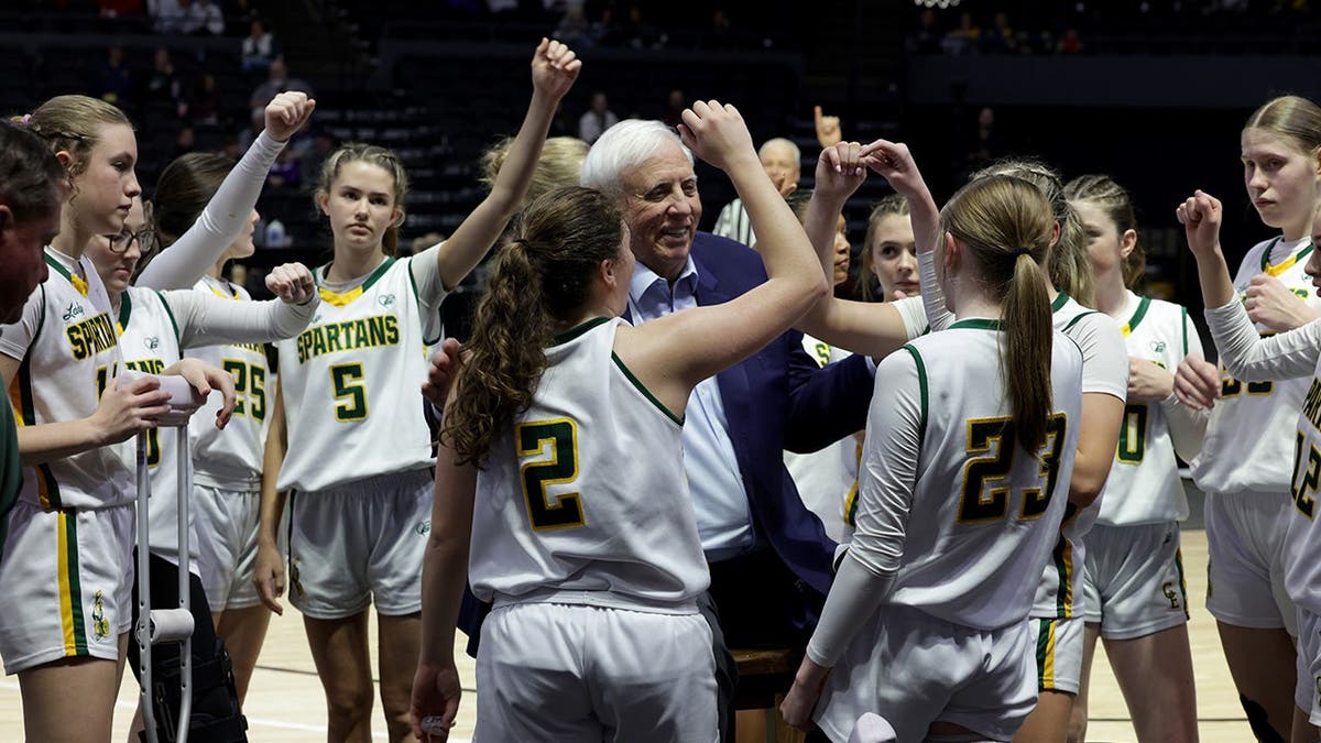 Senator Jim Justice with his women’s basketball team