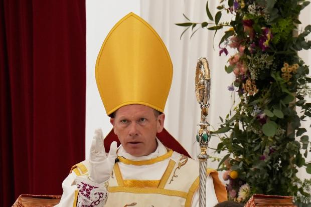 Newly consecrated Bishop Michael Goldade delivers his blessing.
