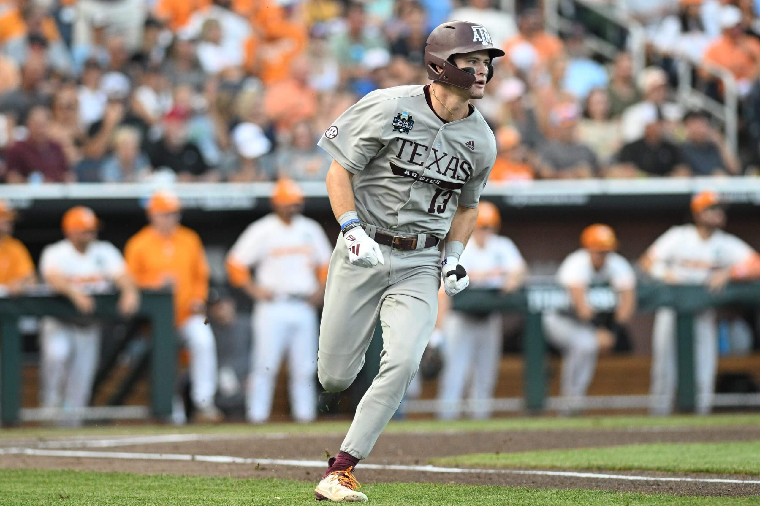 Caden Sorrell (13) drives in a run against the Tennessee Volunteers during the first inning at Charles Schwab Field Omaha.