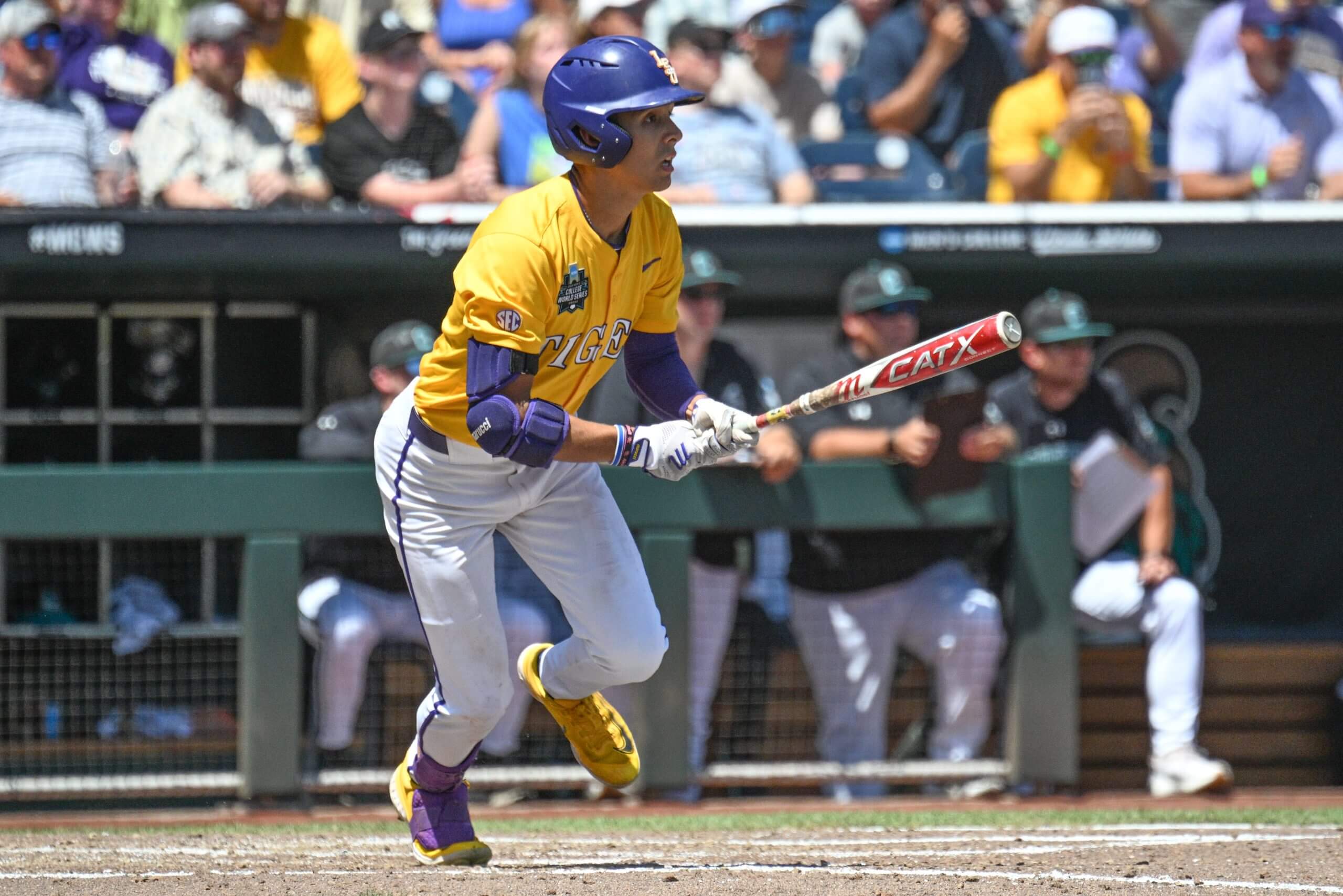 LSU Tigers left fielder Derek Curiel (6) drives in two runs with a single against the Coastal Carolina Chanticleers during the fourth inning at Charles Schwab Field. Mandatory Credit: