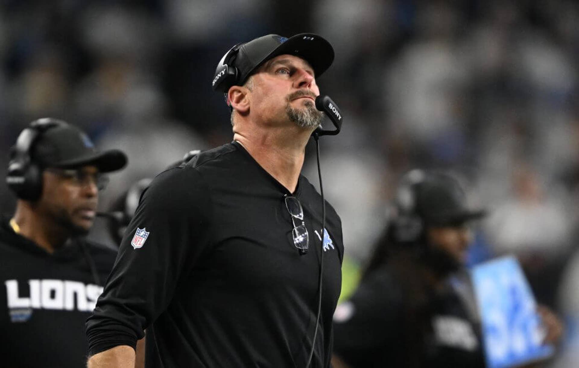 Detroit Lions head coach Dan Campbell looks up at while on the sidelines during the first half against the Dallas Cowboys at Ford Field.