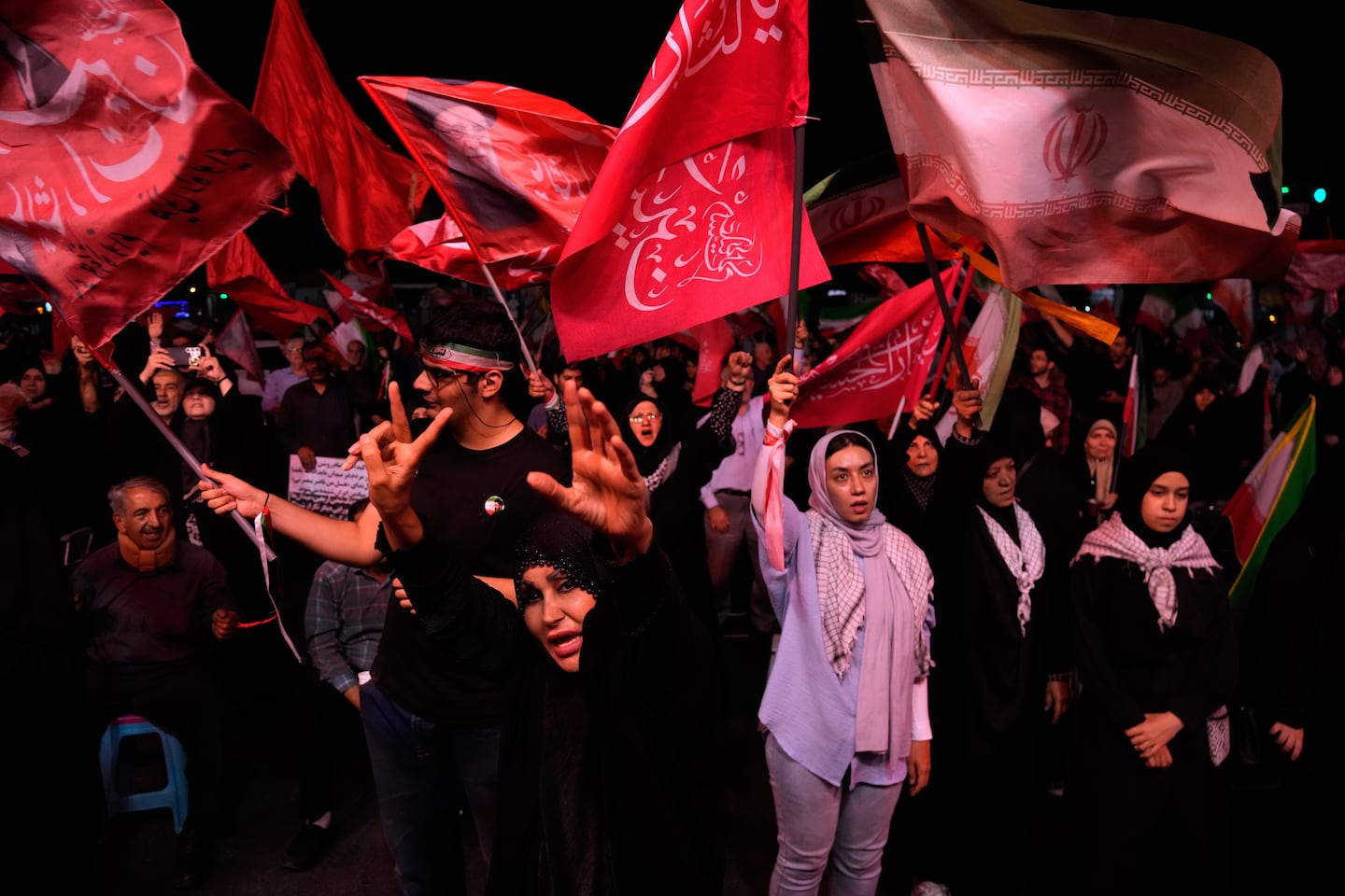 Iranian pro-government demonstrators chant slogans in a gathering at a square in Tehran, Iran, on July 28.