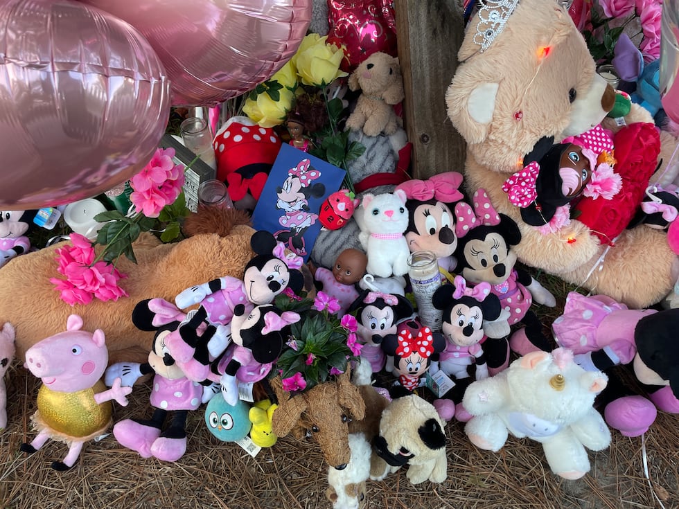 Mourners continue to bring items to add to a makeshift memorial around the mailbox at the home...