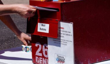 Erin Ludlam places a ballot in a drop-off box for the Democratic primaries at Blair-Caldwell Library, Tuesday, June 30, 2026, in Denver. (AP)