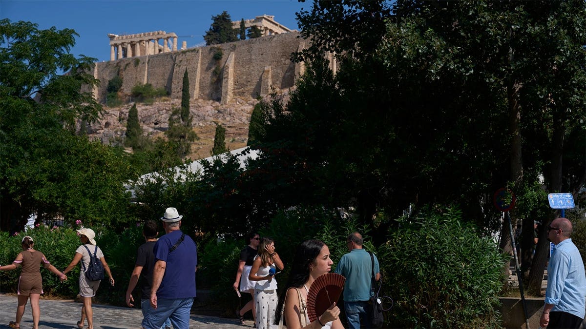 Tourists near the Acropolis in Athens, Greece