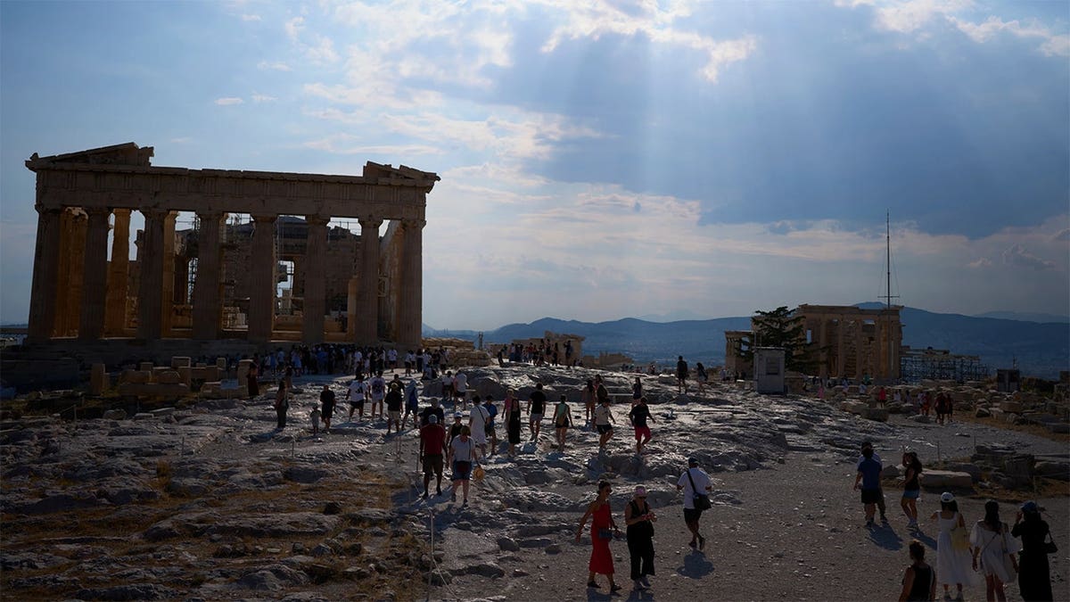Tourists at the Parthenon temple in Athens, Greece