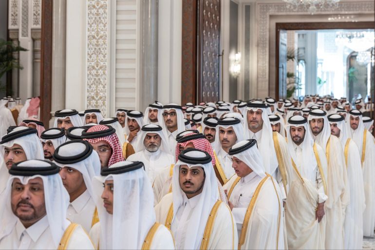This handout photograph released by Qatar's Amiri Diwan shows mourners waiting to offer condolences to the Emir of Qatar following the death of his father, former leader Sheikh Hamad bin Khalifa Al Thani, at Lusail Palace on the outskirts of Doha on July 13, 2026.