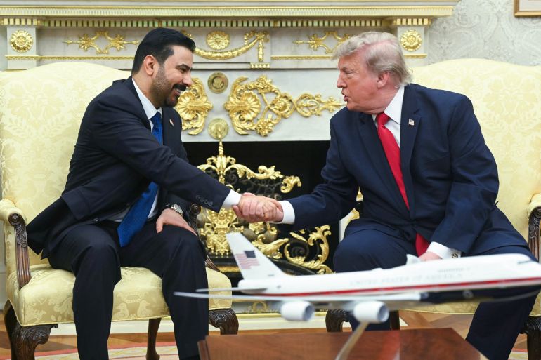 US President Donald Trump shakes hands with Prime Minister of Iraq Ali al-Zaidi (L) in the Oval Office of the White House in Washington, DC, on July 14, 2026. (Photo by SAUL LOEB / AFP)