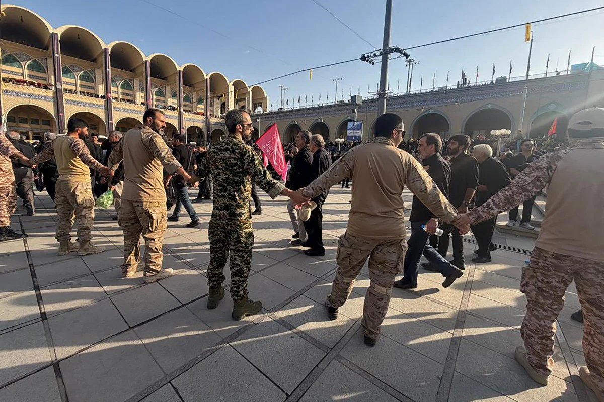 Security personnel form a human chain as a preventive measure to control the crowds gathering at the Grand Mosalla to pay their final respects to Irans former Supreme Leader Ayatollah Ali Khamenei at the start of his funeral ceremonies in Tehran Security personnel form a human chain as a preventive measure to control the crowds gathering at the Grand Mosalla to pay their final respects to Irans former Supreme Leader Ayatollah Ali Khamenei at the start of his funeral ceremonies in Tehran