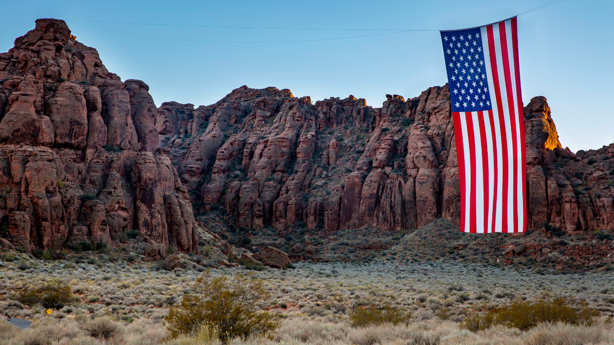 The largest American flag on display in the United States has been stretched on wires across a desert canyon at Snow Canyon State Park as viewed on November 18, 2024 near St. George, Utah.