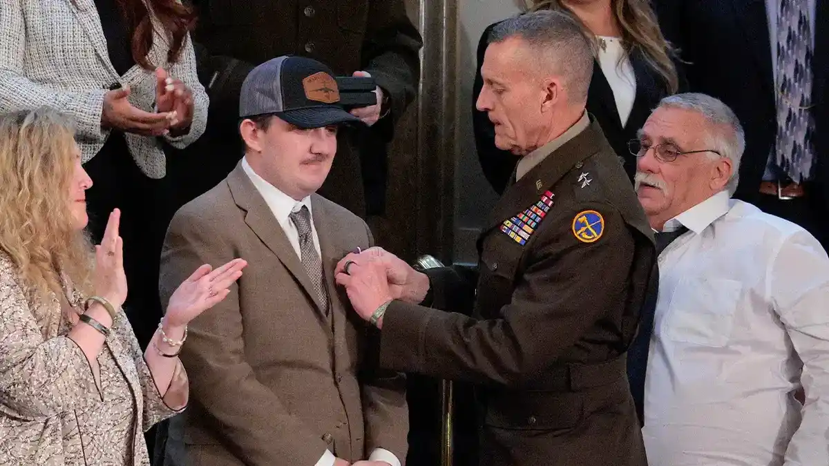 Andrew Wolfe is presented with the Purple Heart