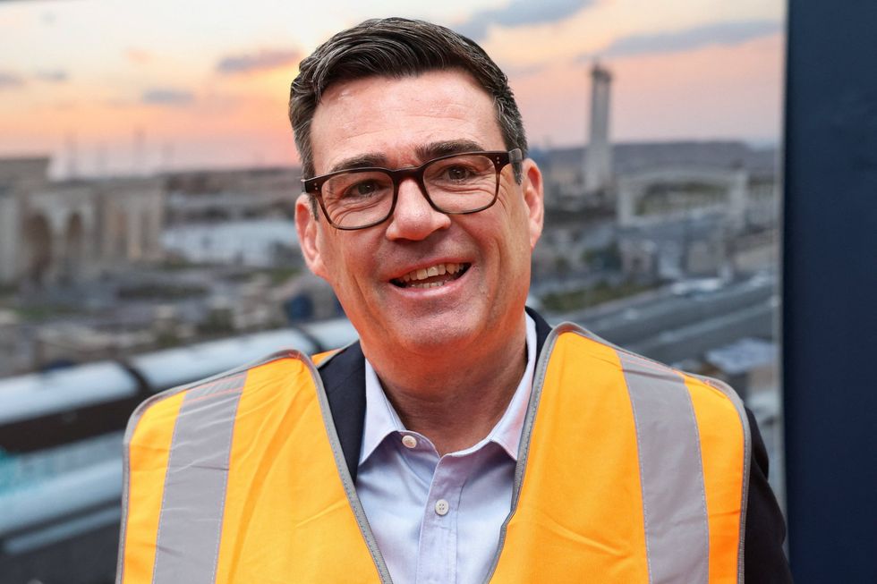 Andy Burnham wearing a safety vest