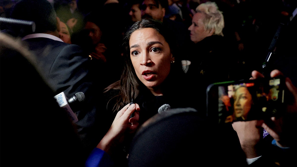 AOC speaks with reporters