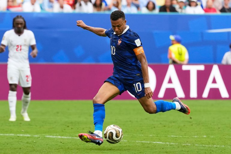 France's Kylian Mbappe (10) scores his side's third goal during the World Cup third-place playoff soccer match between France and England in Miami Gardens, Fla., Saturday, July 18, 2026. (AP Photo/Rebecca Blackwell)