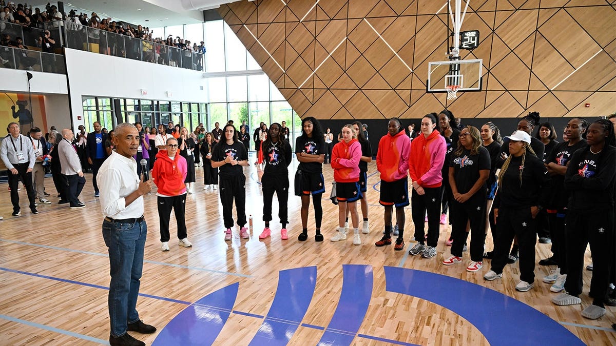 Former President Barack Obama speaks to WNBA All-Stars during practice at Home Court at the Obama Presidential Center in Chicago.