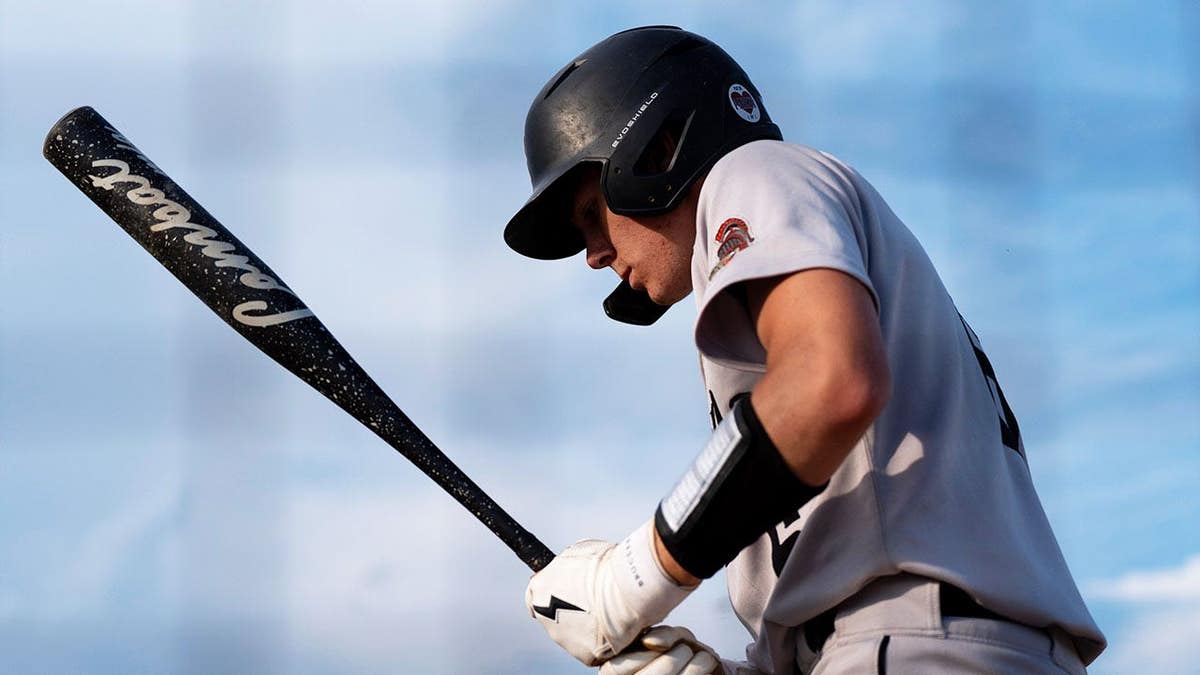 Solonís Carson Kidwell (6) warms up on deck July 2, 2026 during a high school baseball game against Clear Creek Amana in Tiffin, Iowa.