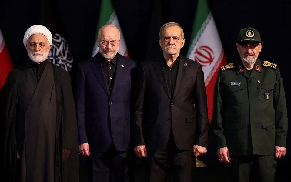 Members of the Tehran regime, including Masoud Pezeshkian, the president, second right, and Mohammad Baqer Qalibaf, the parliament's speaker, second left, attend the ceremonies on Friday