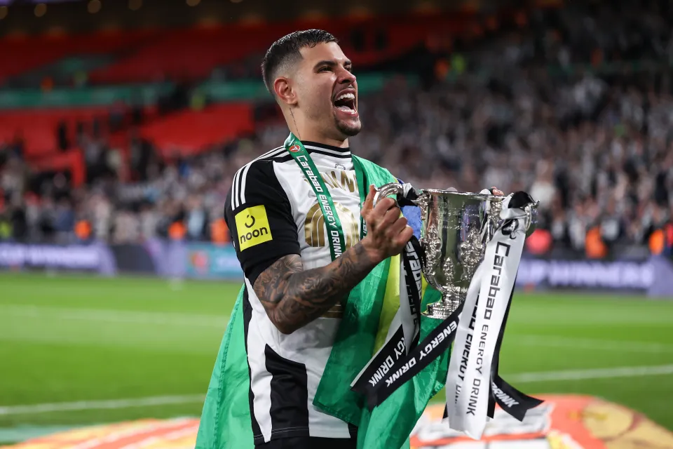 Bruno Guimaraes with the Carabao Cup trophy