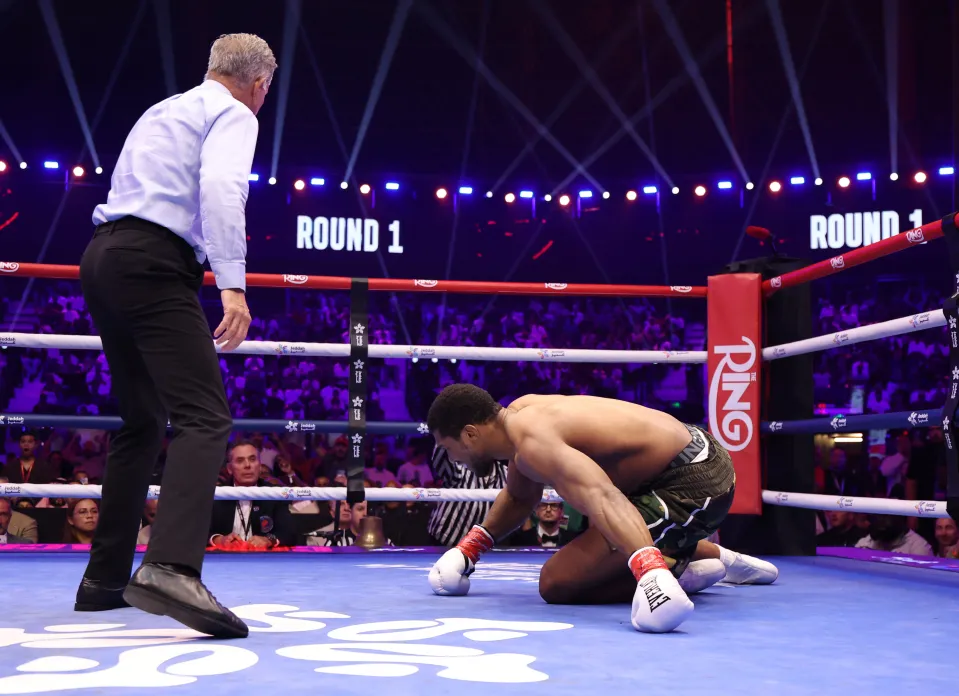 Anthony Joshua being knocked down by Kristian Prenga