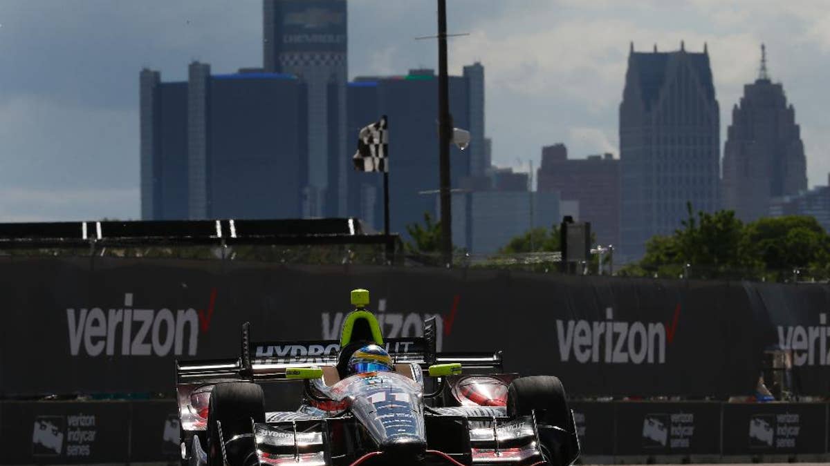 Sebastien Bourdais exits a turn during race two of the IndyCar Detroit Grand Prix auto racing doubleheader on Belle Isle in Detroit, Sunday, June 5, 2016. (AP Photo/Paul Sancya)
